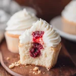 Almond Wedding Cake Cupcakes with Raspberry Filling